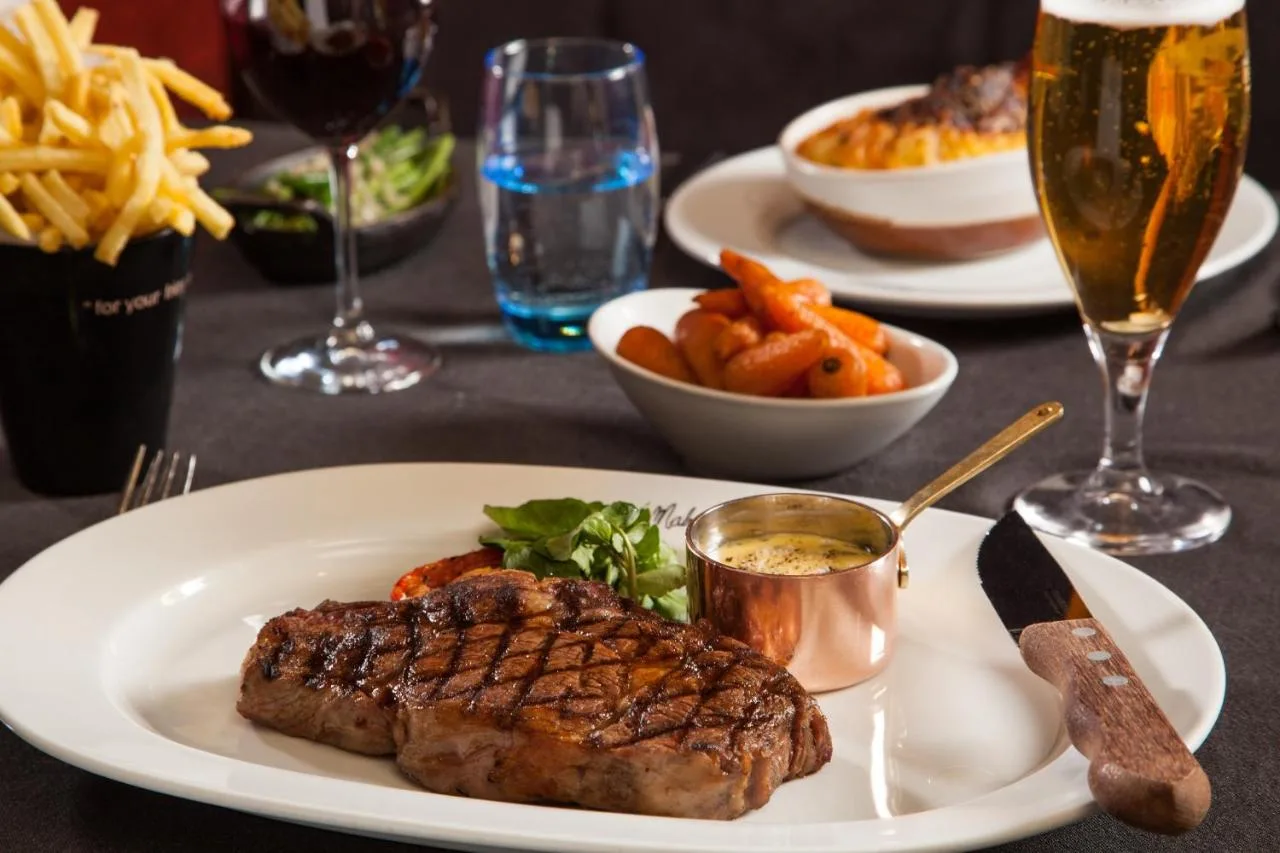 Steak, fries and a beer served at Malmaison Glasgow's bar